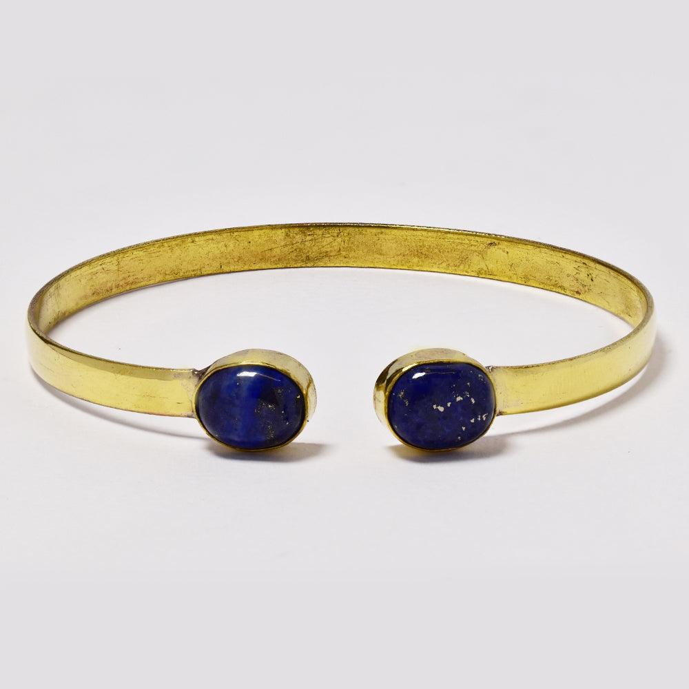 Brass bangle with oval gemstones