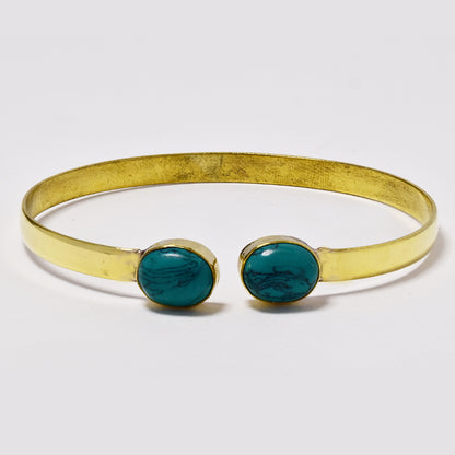 Brass bangle with oval gemstones