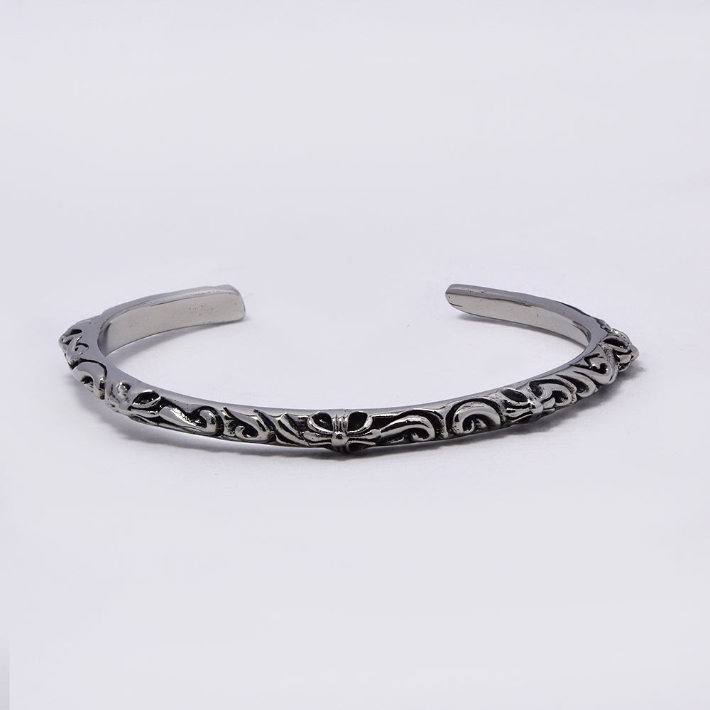 Stainless steel cuff bangle with swirl leafy pattern - NCSSB054