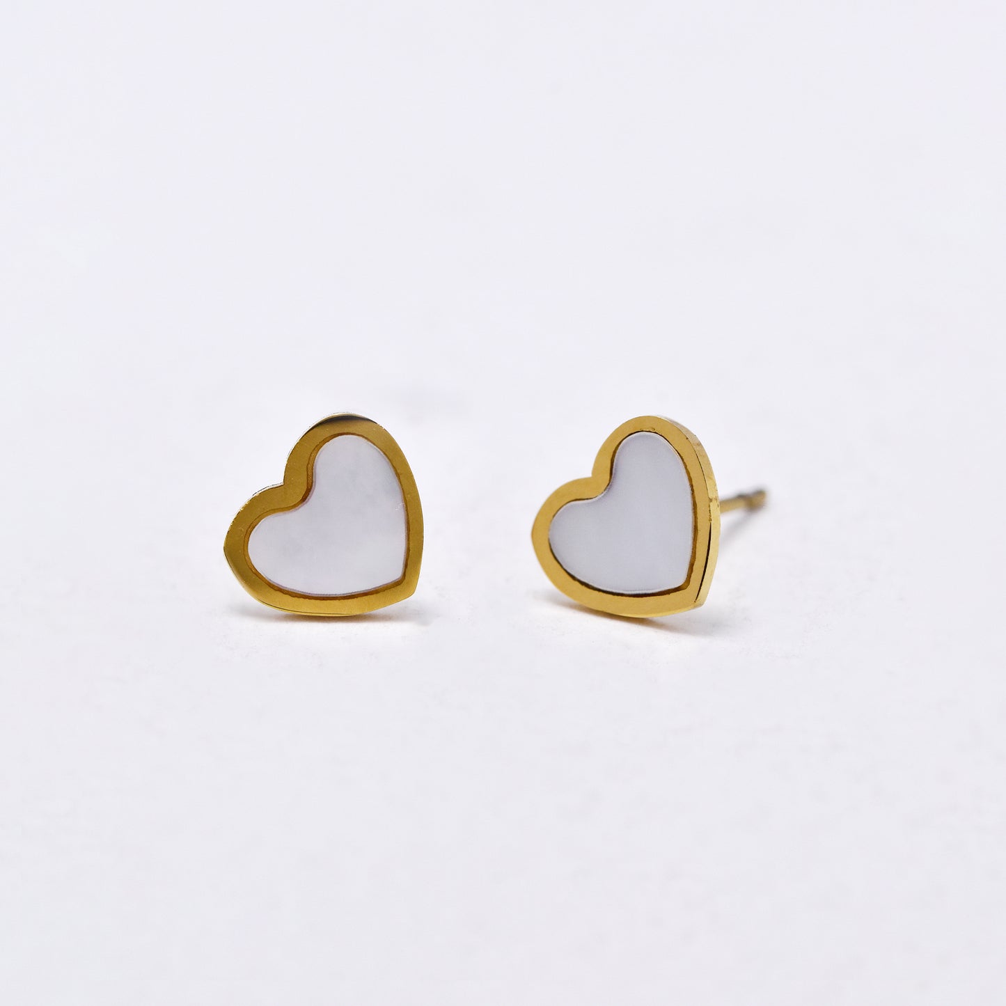 SSYE6007 - St Steel 8mm x 7mm shell heart stud earring