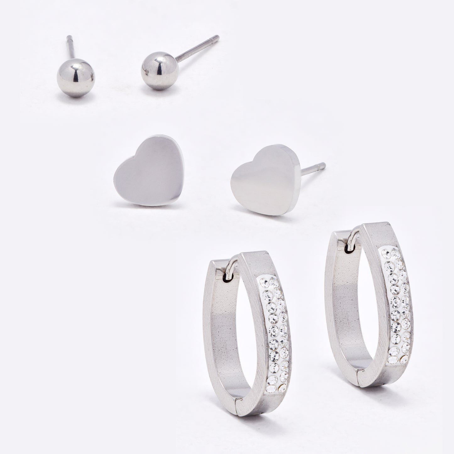 SSYE6752 - St Steel oval crystal huggie, heart & round stud set