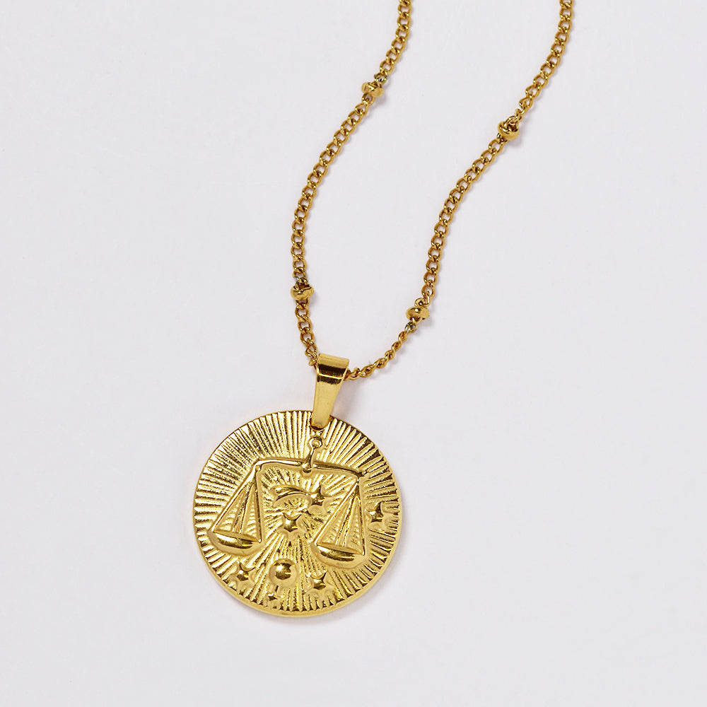 Stainless steel gold plated necklace with zodiac sign on round disc - SSYN4990