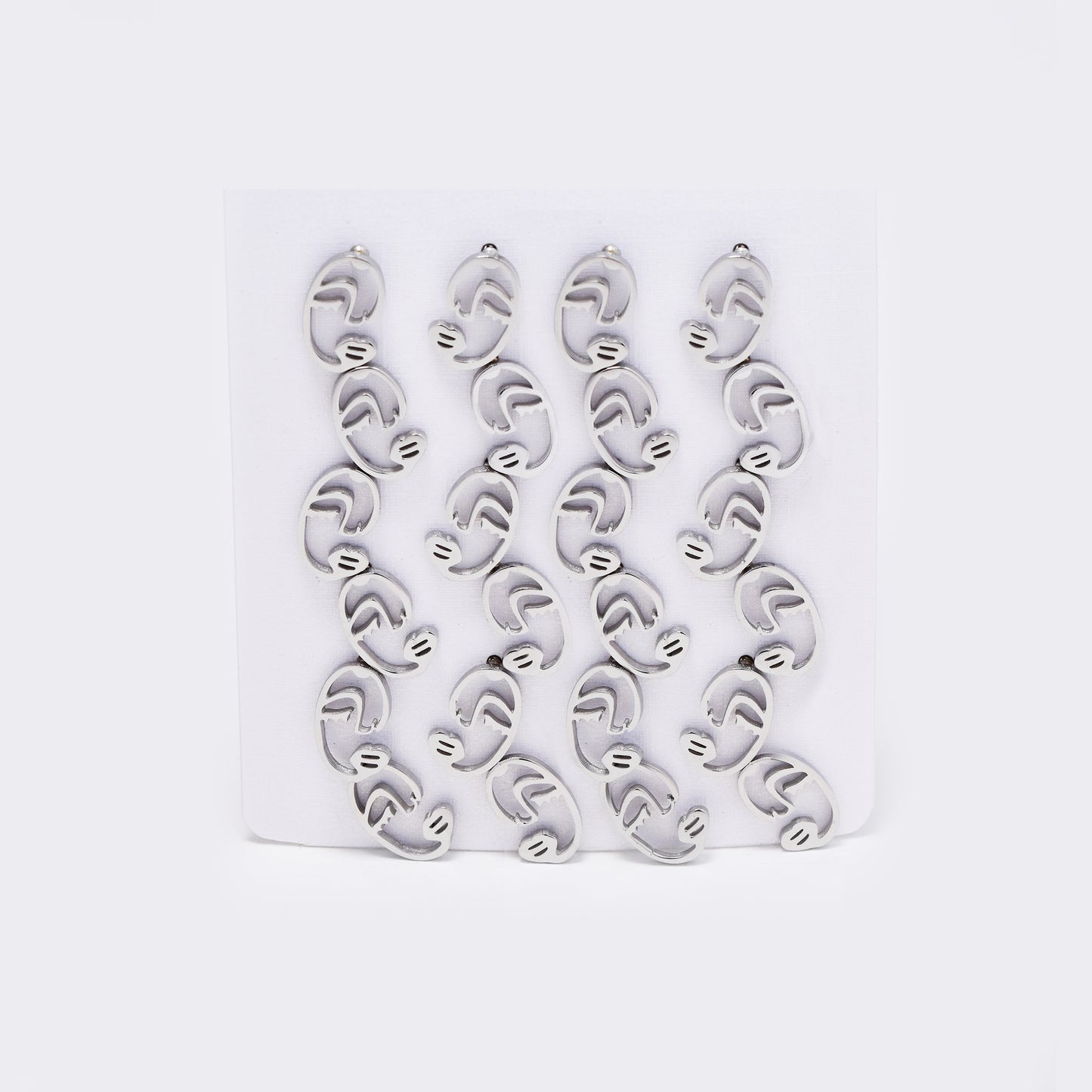 Stainless steel 12 pack half abstract face studs - SSYPK5412