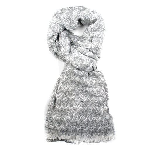 Zigzag pattern scarf with a fringe all the way around the scarf.