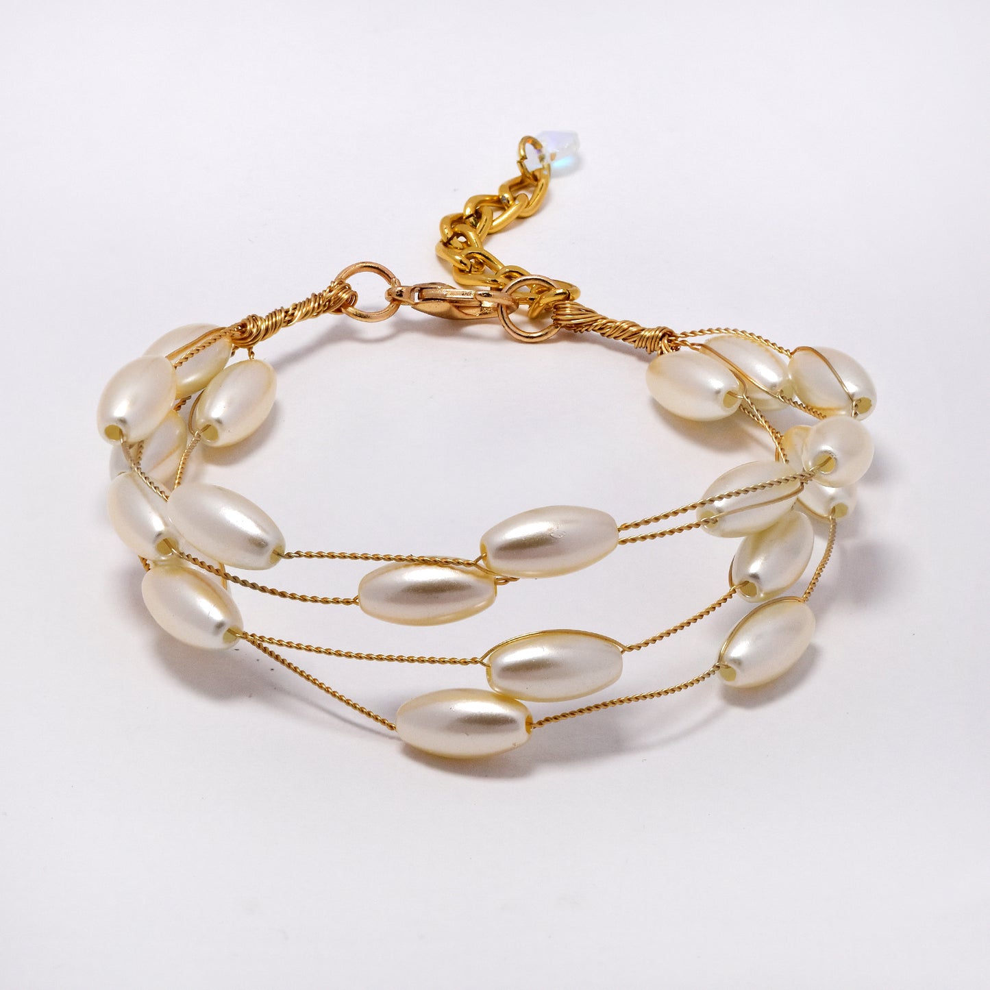 Intertwined multi strand oblong shaped faux pearl bracelet - YB5295