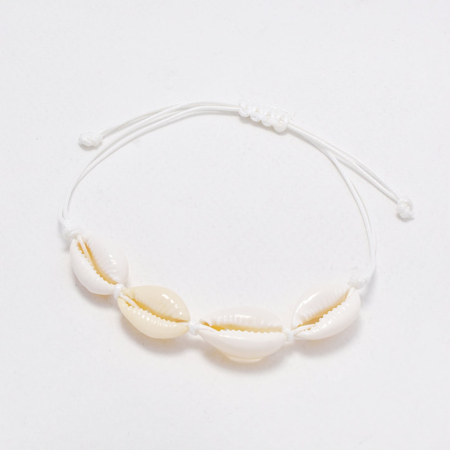 YB6771 - 12 Pack adjustable cowrie shell bracelet