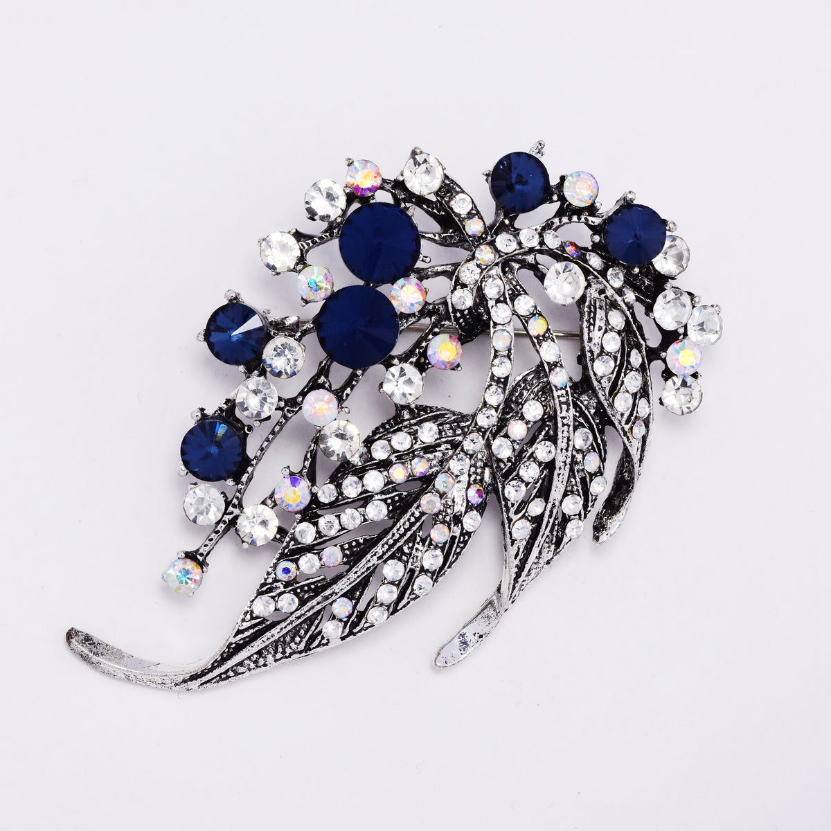 ABBR7816 - Sapphire blue crystal cascading leaf brooch