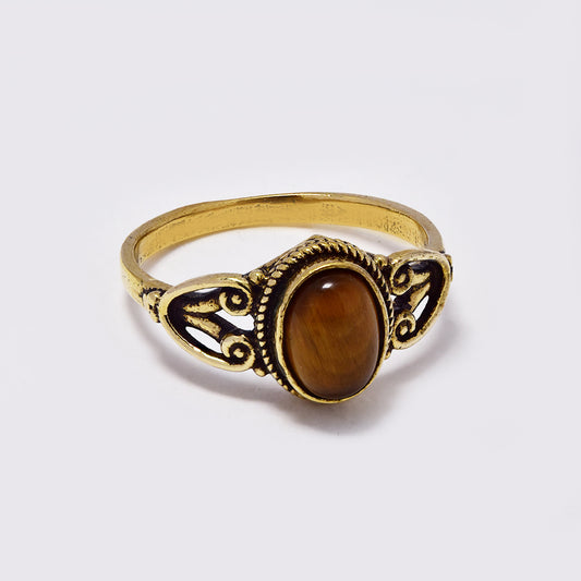 Brass ring with long oval gemstone with rope and filigree frame