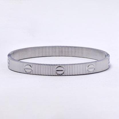 SSYB7210 - Steel 60mm x 50 mm x 7mm textured oval hinged bangle