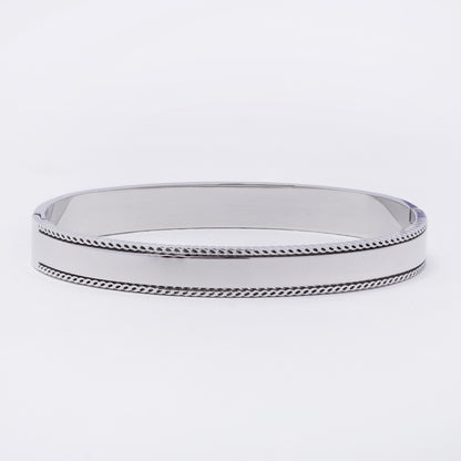 SSYB7263 - Steel 62mm x 49mm x 7.5mm textured edge hinged bangle