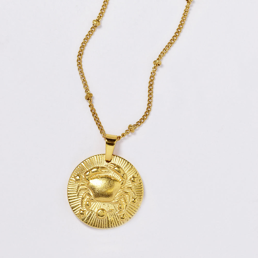 Stainless steel gold plated necklace with zodiac sign on round disc