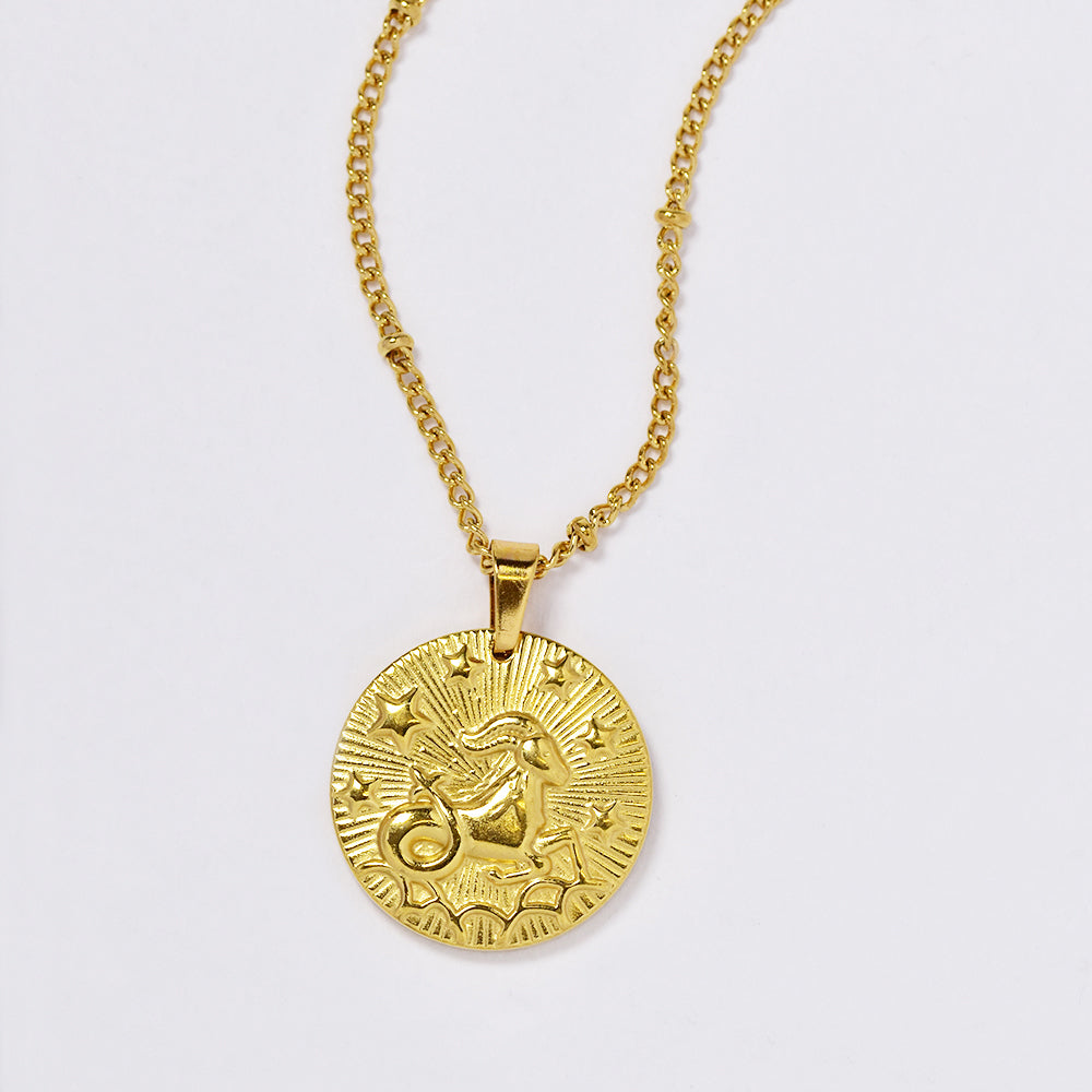 Stainless steel gold plated necklace with zodiac sign on round disc