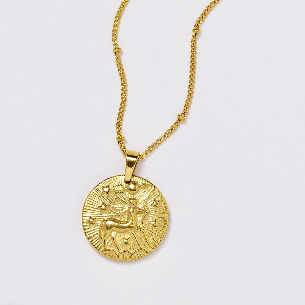 Stainless steel gold plated necklace with zodiac sign on round disc