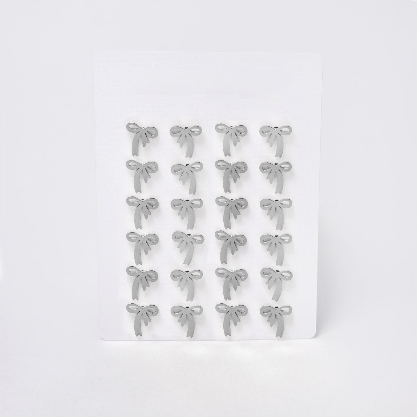 SSYPK7371 - Steel 12 pack bow stud earrings