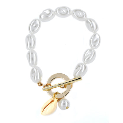 T bar pearl and shell charm bracelet
